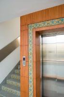 traditional 'Chettinad' tiles used in the lift cladding and on the risers of the steps.